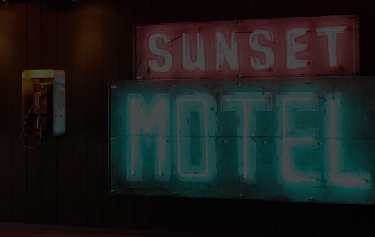 sunset motel in neon lighting